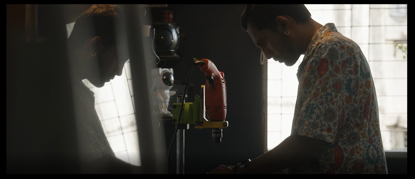 Omkar Dhumal shaping a Shehnai in his workshop